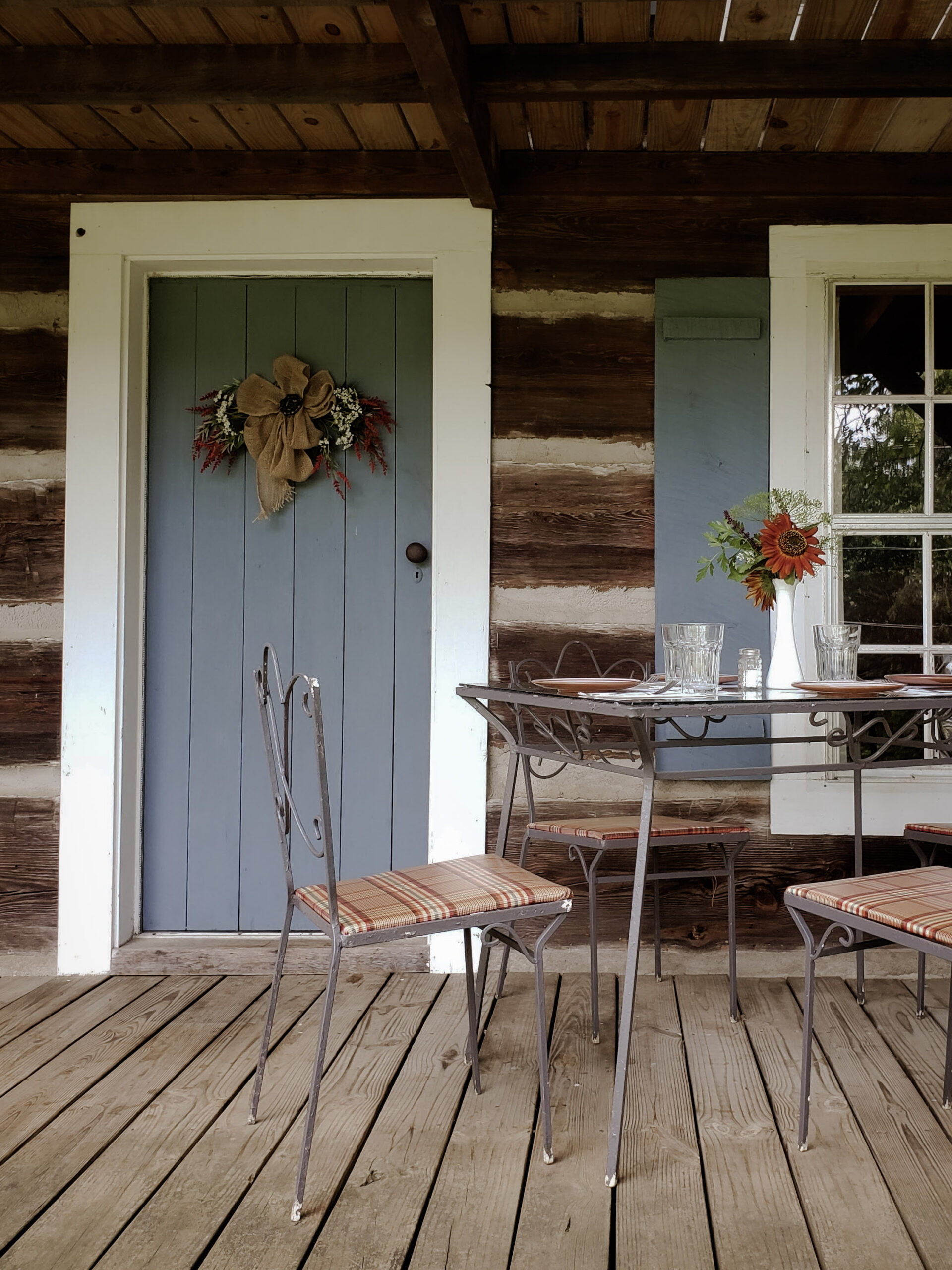 vintage dining experience on the porch of an antique log cabin