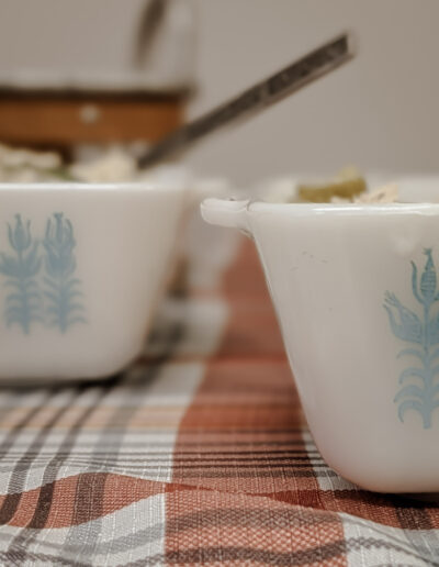 Amish style vintage pyrex on plaid tablecloth